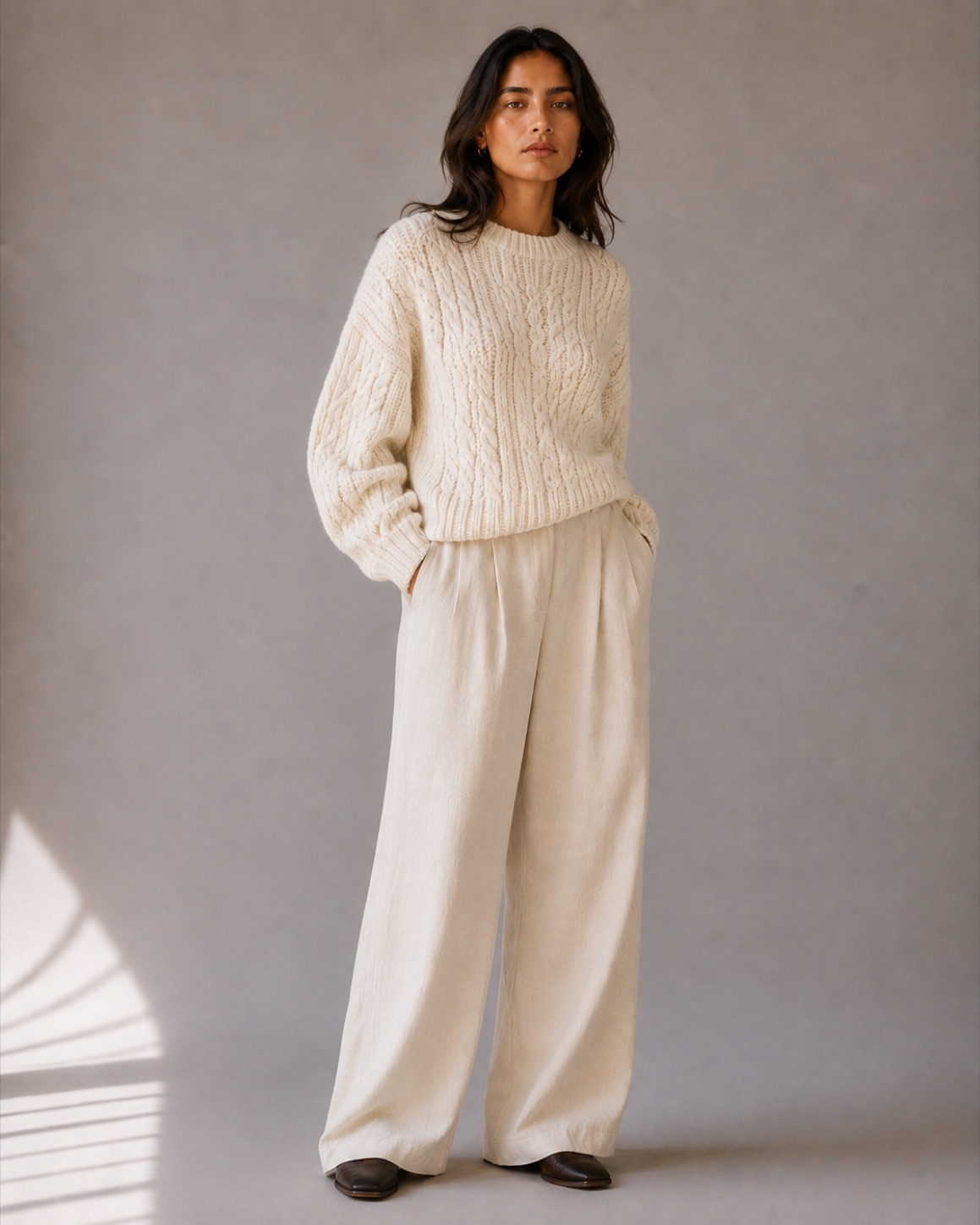 A cream cable knit